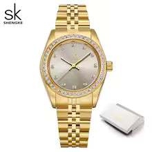 Montre femme SK Shengke couleur or avec cadran décoré de cristaux, bracelet métallique élégant, présentée avec son coffret.